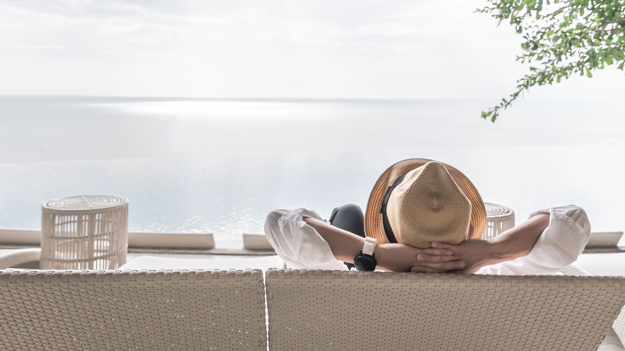 Lying on the beach alone in the sun; image used for HSBC Taiwan HSBC Co-Brand Credit Cards page.